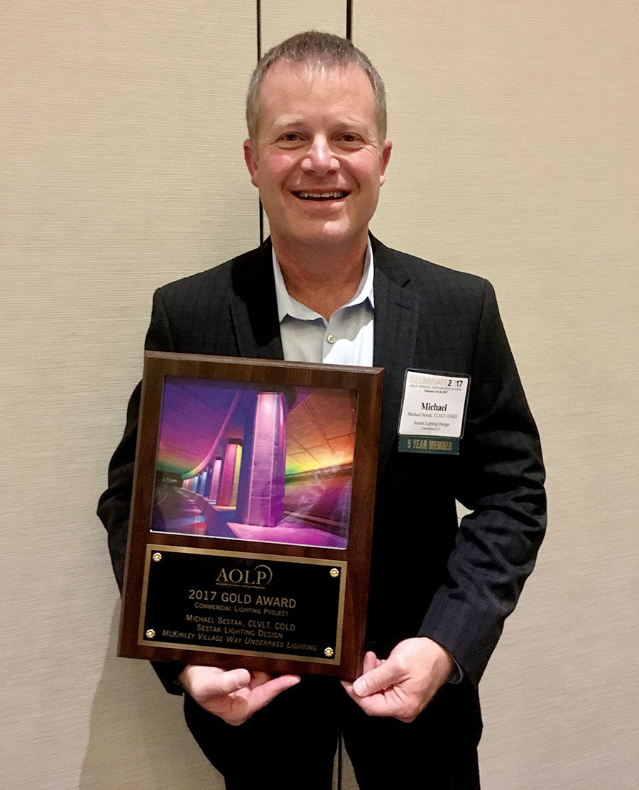 an image of Michael holding his AOLP 2017 Gold Award